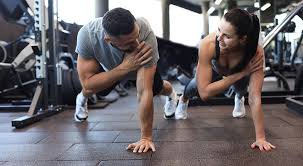 Toning Bingo Wings: Your Ultimate Guide to Sculpting Sleek Arms at the Gym 3 Fitness trainer demonstrating arm toning exercises Walthams Cross