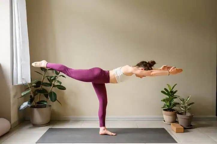 Achieving the Perfect Tone: How Often Should You Exercise for Results? 1 Woman doing Yoga exercise Walthams Cross to help with toning the body.